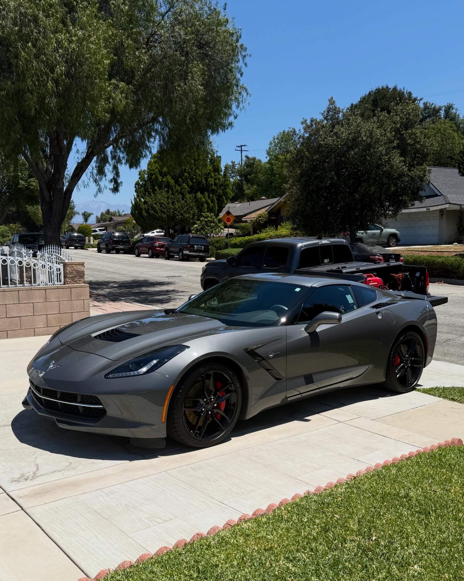 Freshly detailed gray Corvette Stingray in an Anaheim driveway